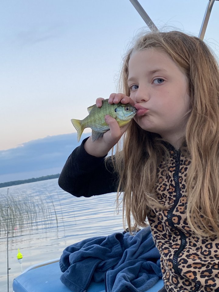 Quinn kissing her fish